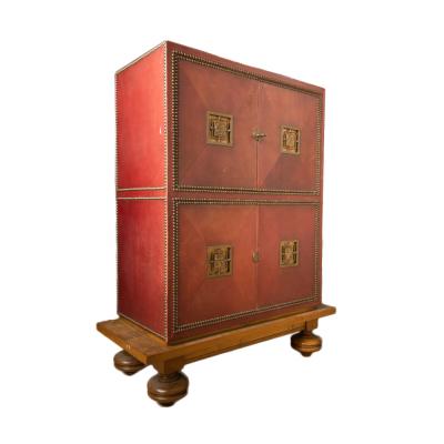 An Art Deco cabinet in deep red leather by M Claude Renard circa 1930 