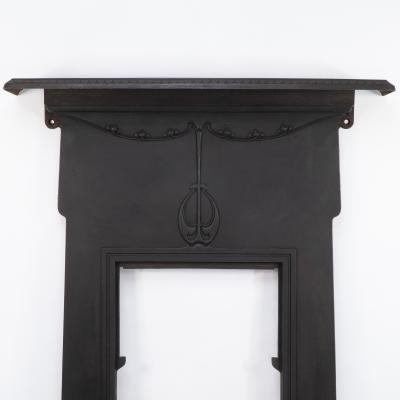 An Arts Crafts Art Nouveau Cast Iron Fireplace with Stylized Floral Details