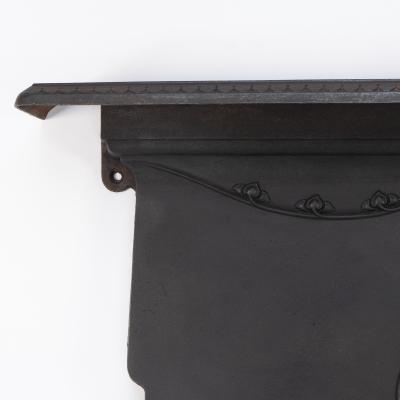 An Arts Crafts Art Nouveau Cast Iron Fireplace with Stylized Floral Details