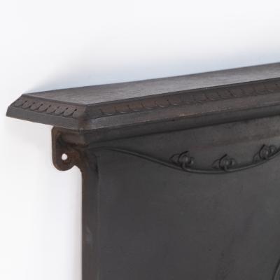 An Arts Crafts Art Nouveau Cast Iron Fireplace with Stylized Floral Details
