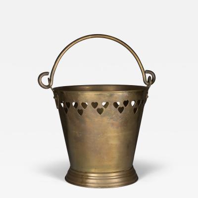An Arts Crafts Brass Champagne Bucket with Pierced Voysey Style Heart Decor