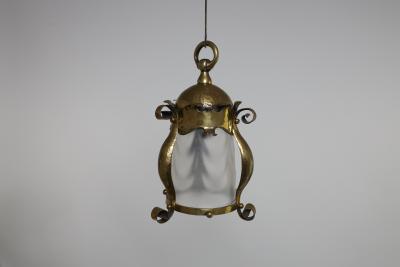 An Arts Crafts Hammered Brass Lantern with Opaque Ribbed Glass Liner