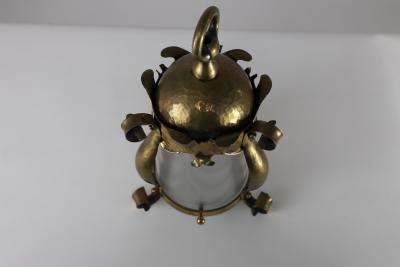 An Arts Crafts Hammered Brass Lantern with Opaque Ribbed Glass Liner