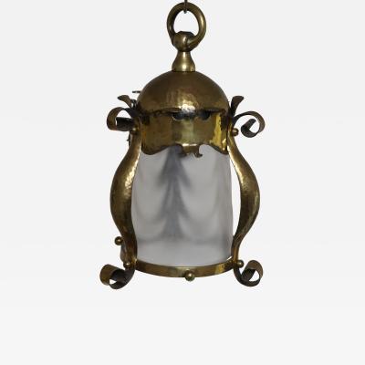 An Arts Crafts Hammered Brass Lantern with Opaque Ribbed Glass Liner