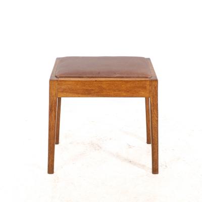 An Arts Crafts Oak Stool with Professional Reupholstered Leather Seat
