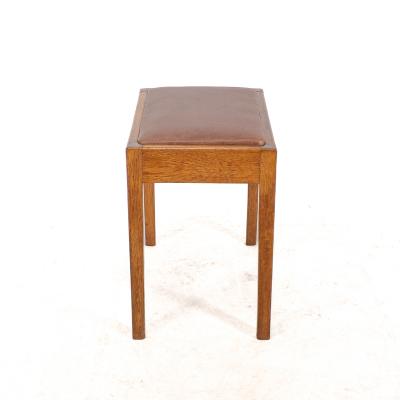 An Arts Crafts Oak Stool with Professional Reupholstered Leather Seat