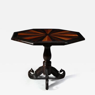 An Ebony Anglo Indian Center Table with Sample Exotic Wood Top Circa 1840