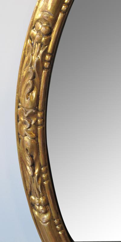 An Elegant Pair of French Napoleon III Carved Gilt Wood Oval Mirrors