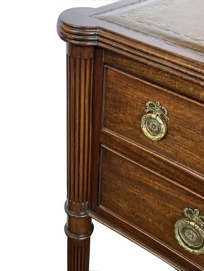 An English George III style mahogany concave writing desk