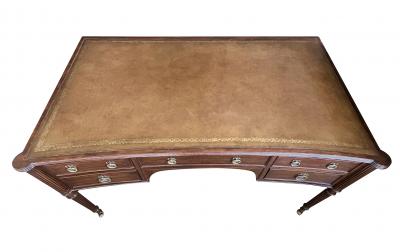 An English George III style mahogany concave writing desk