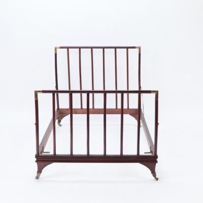 An English brass mounted mahogany campaign bed circa 1900 