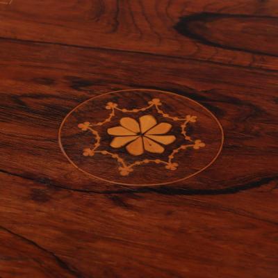 An English rosewood revolving bookcase C 1890