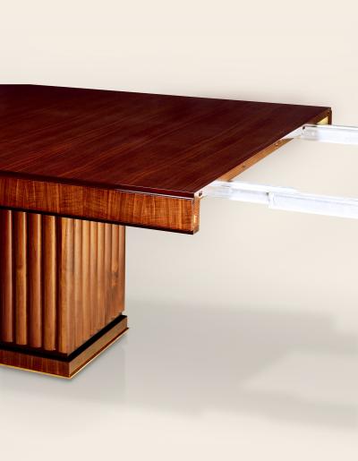 An Extendable Dining Table with Fluted Base by Iliad Design