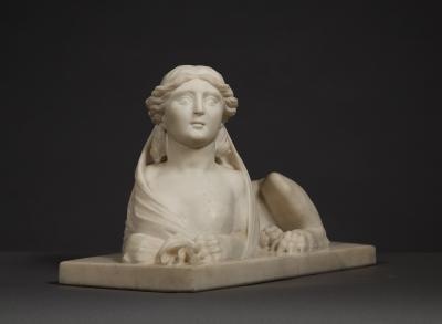 An Imposing Carved Statuary Marble Sculpture Of A Reclining Veiled Female Sphinx