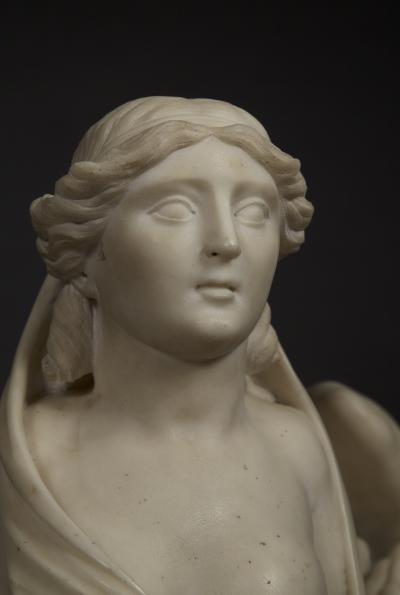 An Imposing Carved Statuary Marble Sculpture Of A Reclining Veiled Female Sphinx