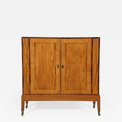 An Interesting Pair Of Satinwood Two Door Cabinets En Quatre Face