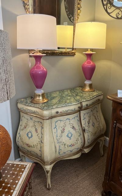 An Italian Rococo Style Butter yellow Painted Bombe Cabinet