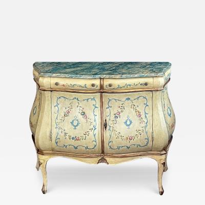 An Italian Rococo Style Butter yellow Painted Bombe Cabinet