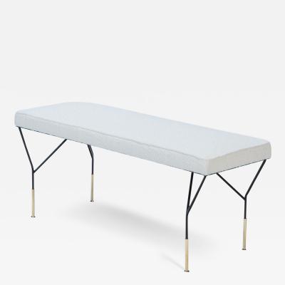 An Italian contemporary metal and brass bench with white upholstered seat 