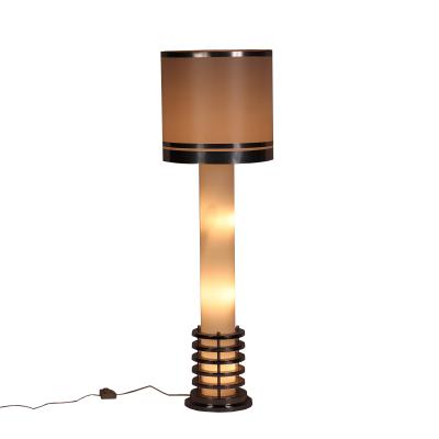 An Italian mid century modern floor lamp in polished chrome and opaline glass