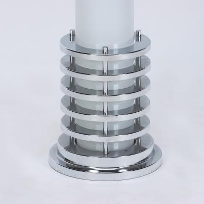 An Italian mid century modern floor lamp in polished chrome and opaline glass