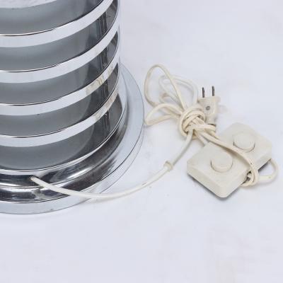 An Italian mid century modern floor lamp in polished chrome and opaline glass