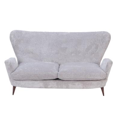 An Italian vintage wingback drop arm upholstered settee 