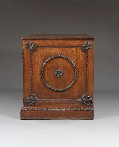 An Oak Two Door Folio Cabinet With Carved Kentian Detailing
