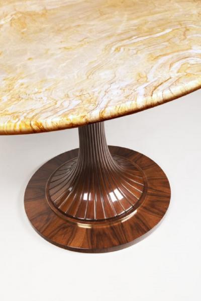 An Oval Pedestal Table by ILIAD Design