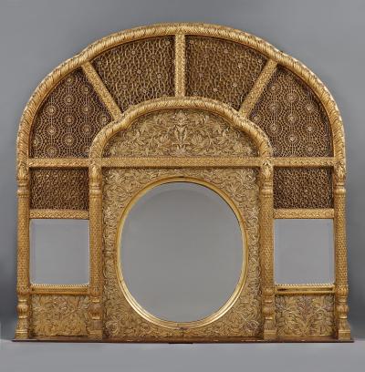 An Overmantel Mirror With Panels Of Mughal Inspired Carved Geometric Tracery
