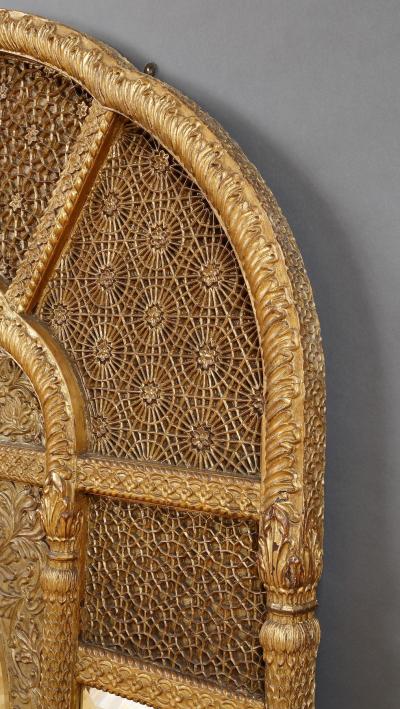 An Overmantel Mirror With Panels Of Mughal Inspired Carved Geometric Tracery