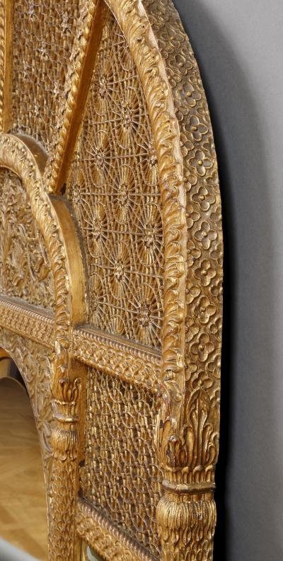 An Overmantel Mirror With Panels Of Mughal Inspired Carved Geometric Tracery