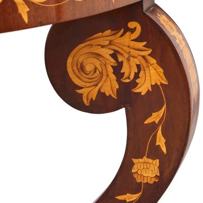 An antique French circular marquetry table with floral inlay