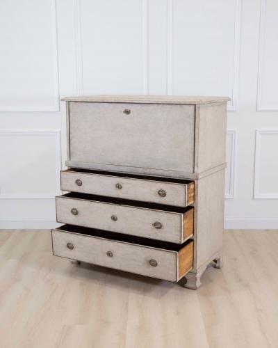 An antique Swedish bureau in antique white