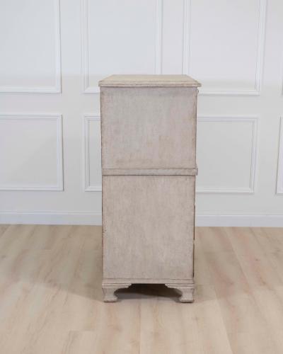 An antique Swedish bureau in antique white