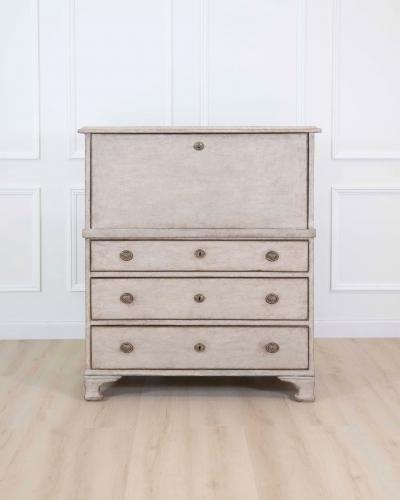 An antique Swedish bureau in antique white