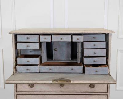 An antique Swedish bureau in antique white