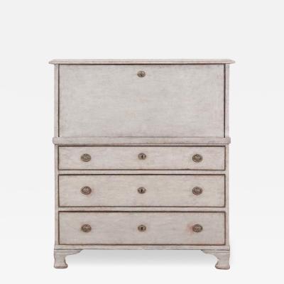 An antique Swedish bureau in antique white