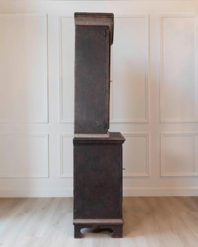 An antique Swedish two piece cupboard in black and grey