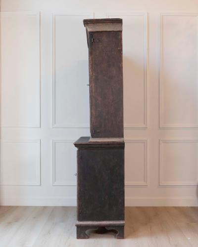 An antique Swedish two piece cupboard in black and grey