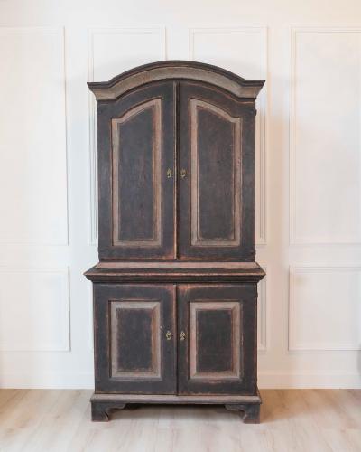 An antique Swedish two piece cupboard in black and grey