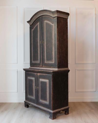 An antique Swedish two piece cupboard in black and grey