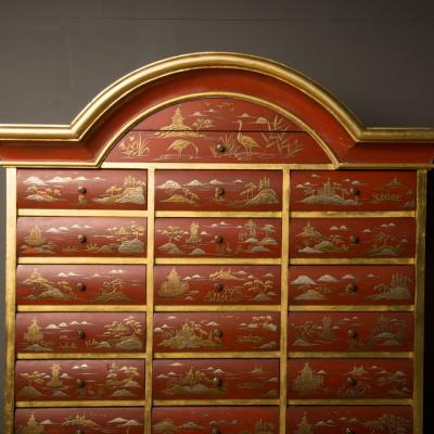 An antique chinoiserie lacquer storage cabinet on carved giltwood stand