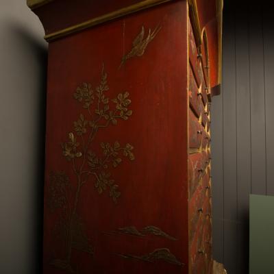 An antique chinoiserie lacquer storage cabinet on carved giltwood stand