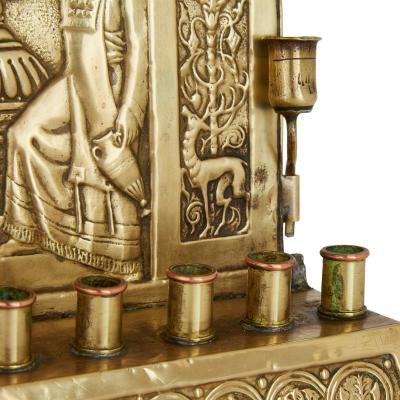An early 20th century antique brass Judaica Menorah by the Bezalel Academy