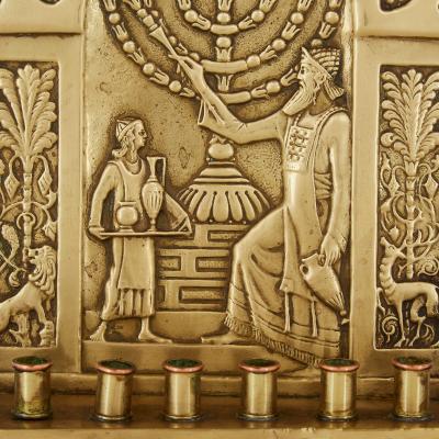 An early 20th century antique brass Judaica Menorah by the Bezalel Academy