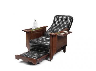 An early 20th century mahogany Glenisters patent reclining gaming