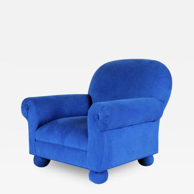 An electric blue upholstered custom made roll arm club chair Circa 1995 