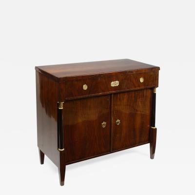 An elegant Biedermeier trumeau commode