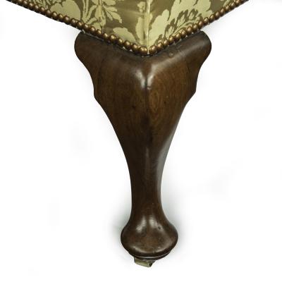 An elegant George I walnut wing armchair